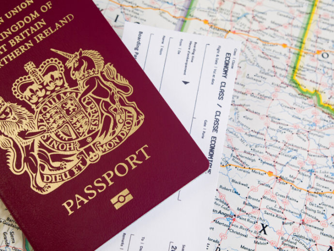 UK Passport on a map and ticket